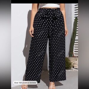 Black polka dot pants.